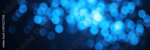 A blurry photo of bright blue lights against a dark background