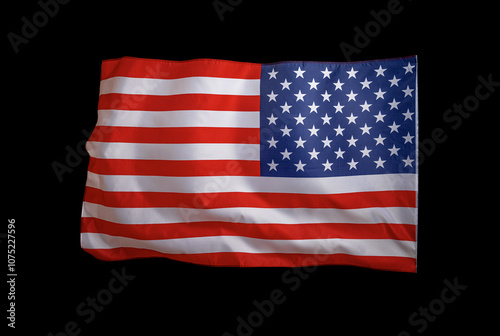 Flag of the United States of America. The US flag flutters in the wind. On a black background.