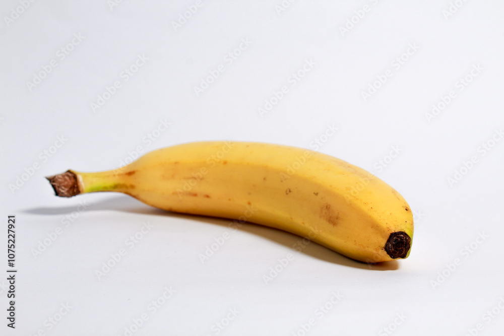 Yellow ripe banana shot on isolated white background Yellow ripe banana shot on isolated white background