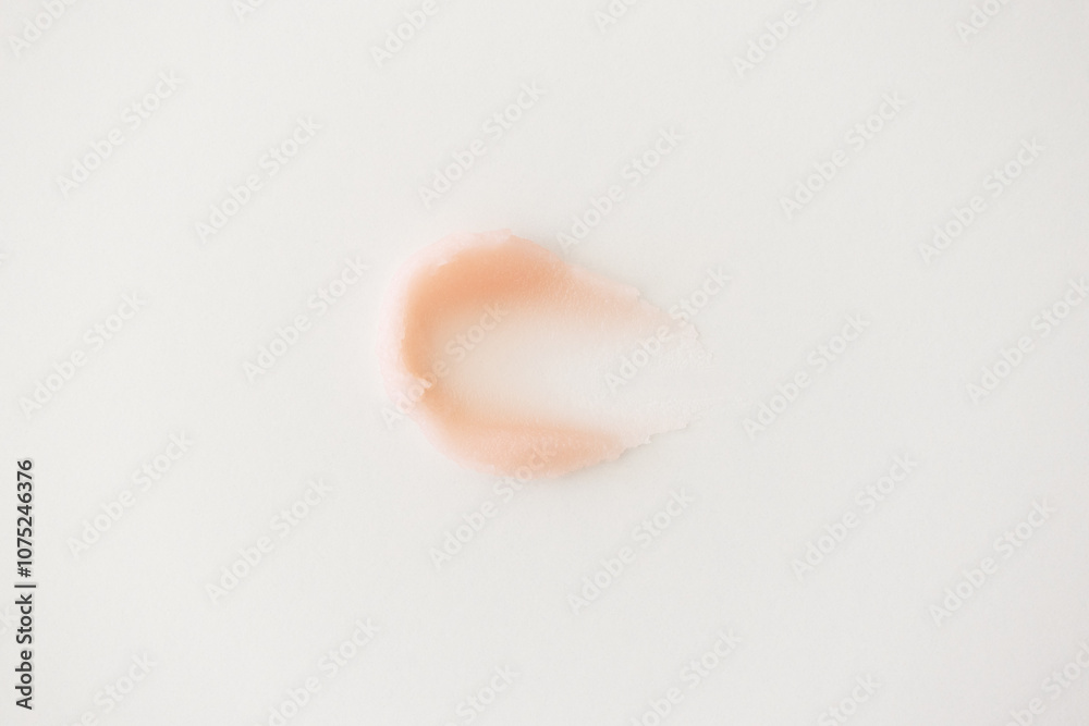 Fototapeta premium Pink cream lip balm texture skincare beauty product on white background