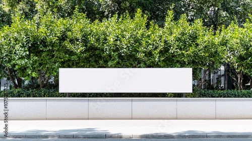 A pristine blank sign against a backdrop of lush greenery, offering a perfect space for marketing messages or artwork. Ideal for design projects.