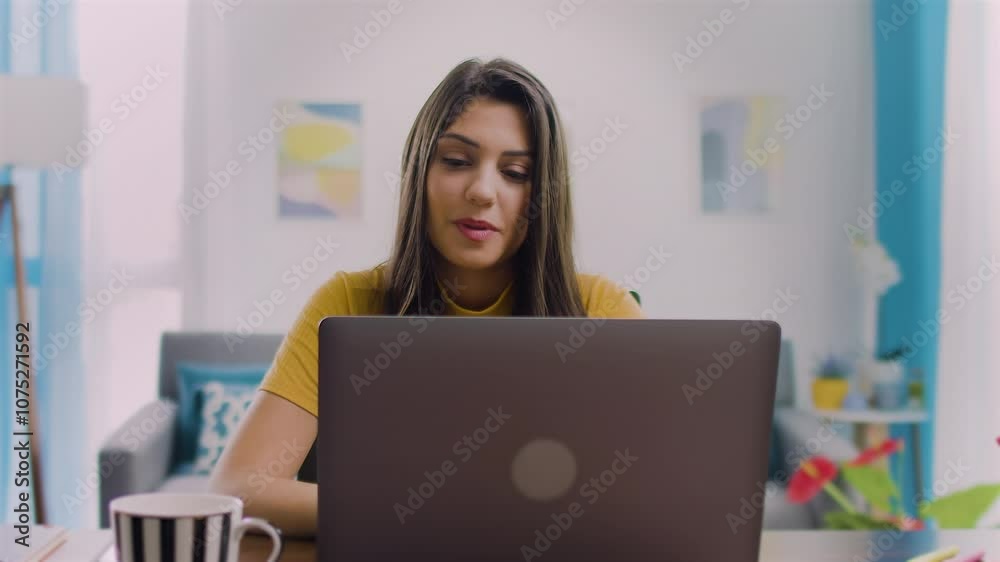 Business Woman Ceo Using Laptop For Work Sitting At Table In Office And Looking At Camera. Smiling Latin Hispanic Adult Professional Businesswoman Using Pc Digital Computer

