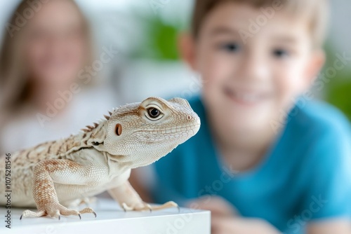 Pet lizard close-up with smiling children in the background, highlighting curiosity and connection. photo