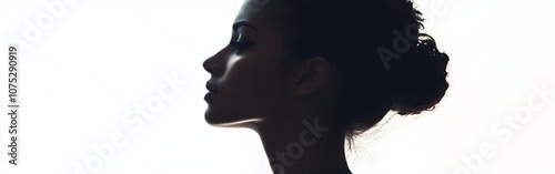 Pensive Woman Silhouette against Serene White Background