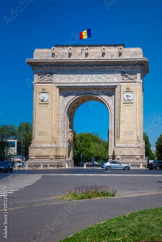 Historical monument in Bucharest, Romania. Arch of Triumph representing the victory of Romanian soldiers who managed to liberate the capital in the second world war.  photo