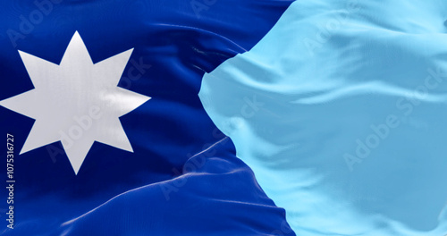 Close-up of Minnesota new state flag waving with the american flag on a clear day photo