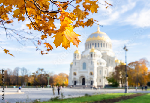 Autumn foliage against the background of the Naval Cathedral of St. Nicholas in Kronstadt. Autumn Krondstadt.