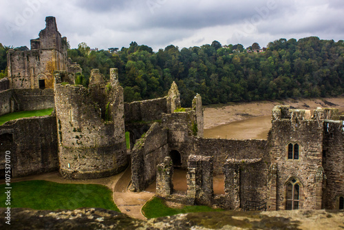 Looking out over the impressive ruins of Chepstow Castle, on the bank of the river Wye, in Wales,  as seen from one of the remaining towers, photo