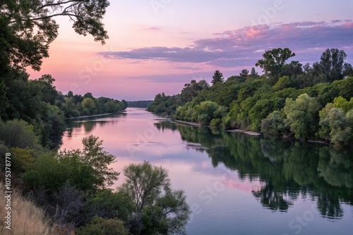 Lush greenery and tranquil water of the Sacramento River at dusk, atmospheric, golden hour, scenic, dusk