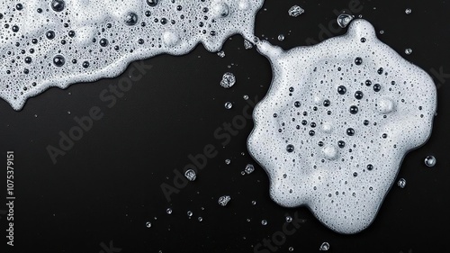 A beer foam splash on a dark background with visible sudsy texture and scattered droplets, nightlife scene, beverage spill