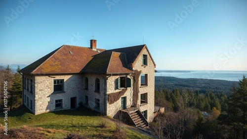 Wallpaper Mural Abandoned sanatorium with crumbling stone facade and moss-covered roof overlooking a serene forest landscape near the Baltic Sea, nature, trees, abandoned Torontodigital.ca