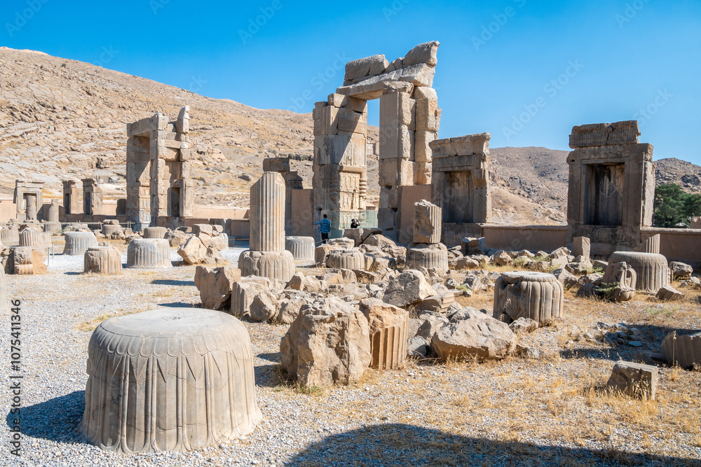Obraz premium Persepolis, beautiful stone archway stands tall with a blue sky, Iran
