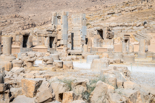 Persepolis, beautiful stone archway stands tall with a blue sky, Iran