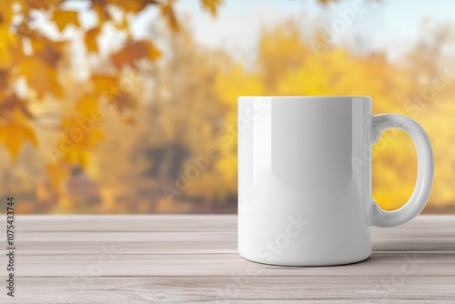 A blank white coffee mug sits on a wooden table against a backdrop of vibrant autumn foliage in soft sunlight