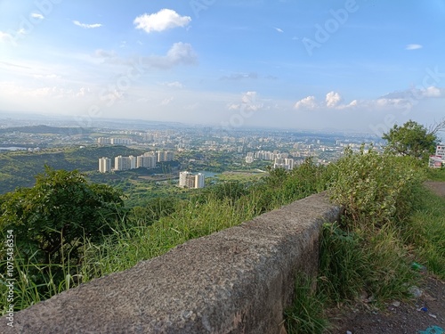 Pune, Maharashtra, India: 12 October 2024: A silent scene from the Bopdev mountain in Pune with clouds, trees, and landscape scene in the morning. photo