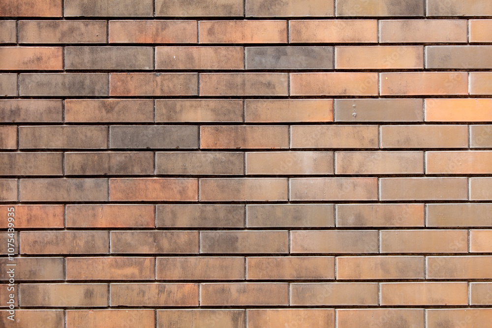 A brick wall with a brownish color A brick wall with a brownish color