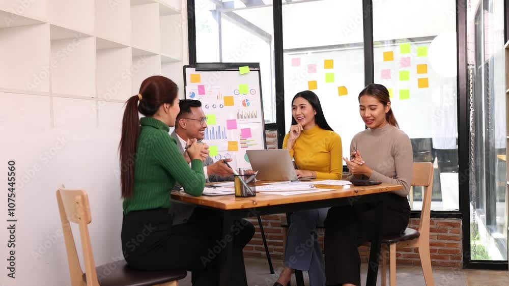 Team of Asian creative business teamwork and startup worker meeting in office. Coworkers young woman team at work, Group of young business working together with analysis report chart in office. Team of Asian creative business teamwork and startup worker meeting in office. Coworkers young woman team at work, Group of young business working together with analysis report chart in office.