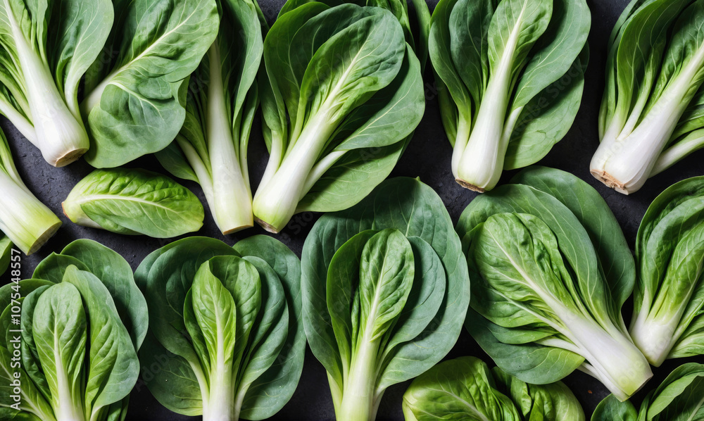 Fresh bok choy arranged on a dark surface Fresh bok choy arranged on a dark surface