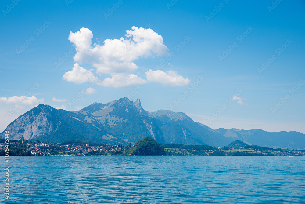 view over lake Thunersee to tourist resort Spiez and Stockhorn mountain, switzerland view over lake Thunersee to tourist resort Spiez and Stockhorn mountain, switzerland