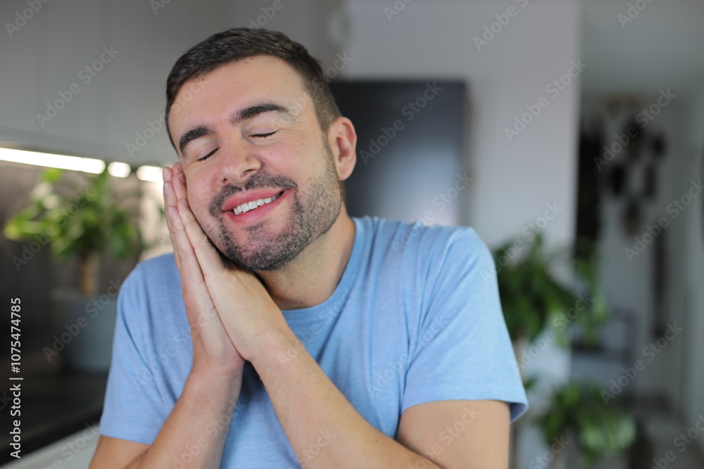 Man pretending to go to sleep with hands gesture Man pretending to go to sleep with hands gesture