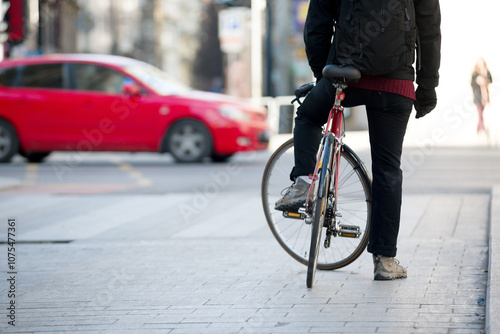 Bicyclist on the street lets traffic through