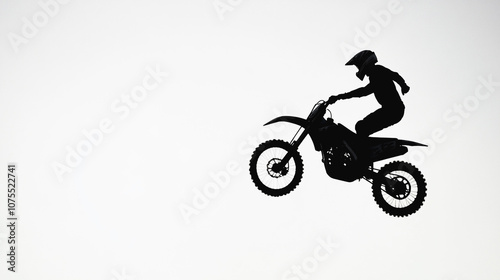 Silhouette of Motocross Rider in mid air Jump