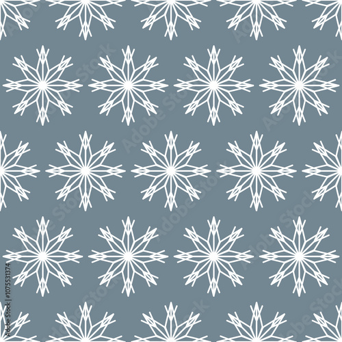 Seamless pattern of white snowflakes on a gray background
