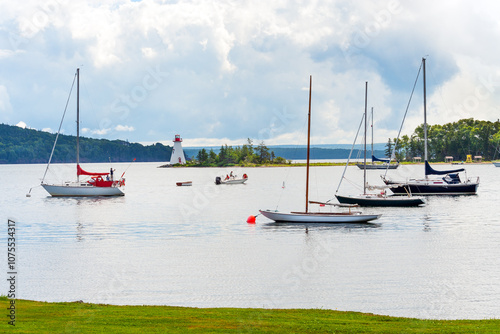 Boats and lighthouse on Bras D'Or lake, Cape Breton, Nova Scotia