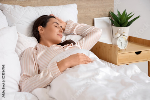 Young woman in pajamas slee...