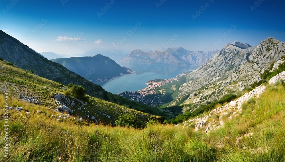 Naklejka premium A grassy mountain slope rises to reveal the Adriatic Sea and distant coastline near the Bay_1(322)