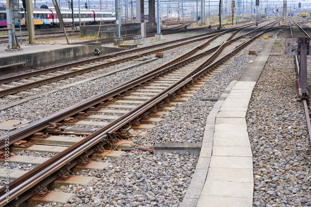 High angle view of railway track with gravel and concrete railway sleepers at Swiss railway station Zürich Altstetten on an autumn day. Photo taken November 11th, 2024, Zurich, Switzerland. High angle view of railway track with gravel and concrete railway sleepers at Swiss railway station Zürich Altstetten on an autumn day. Photo taken November 11th, 2024, Zurich, Switzerland.