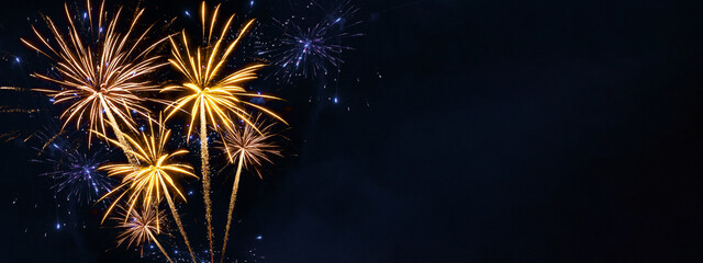 Silvester, happy new year, new year's eve 2026, new year's eve background banner - Golden firework fireworks pyrotechnics on dark black night sky