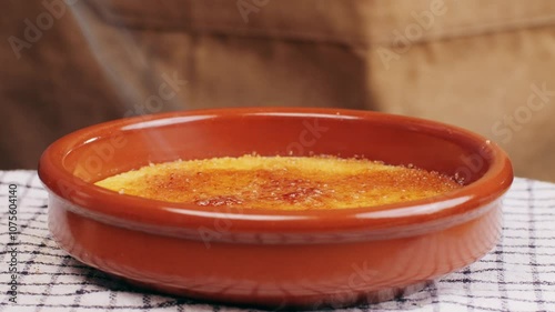 Spanish traditional food, catalonian dessert, crema catalana, catalan cream, spanish dessert close up, cooking. photo