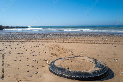 Old car tire on the beach in Morocco