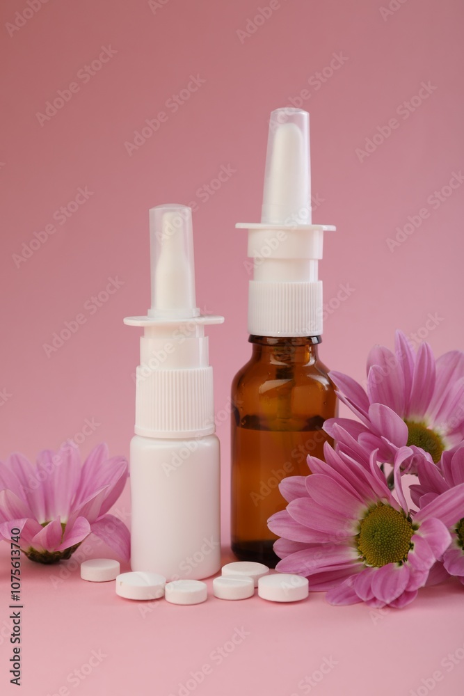 Allergy treatment. Different medications and flowers on pink background Allergy treatment. Different medications and flowers on pink background