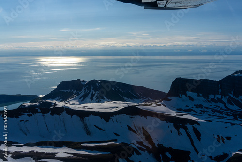 Breathtaking View of Snow-Capped Mountains Reflecting on Tranquil Lake