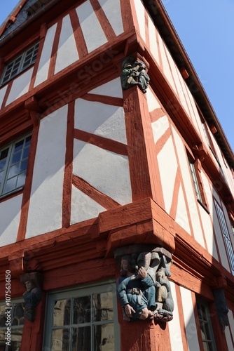Wooden sculptures on an half timbered house in Malestroit, France 