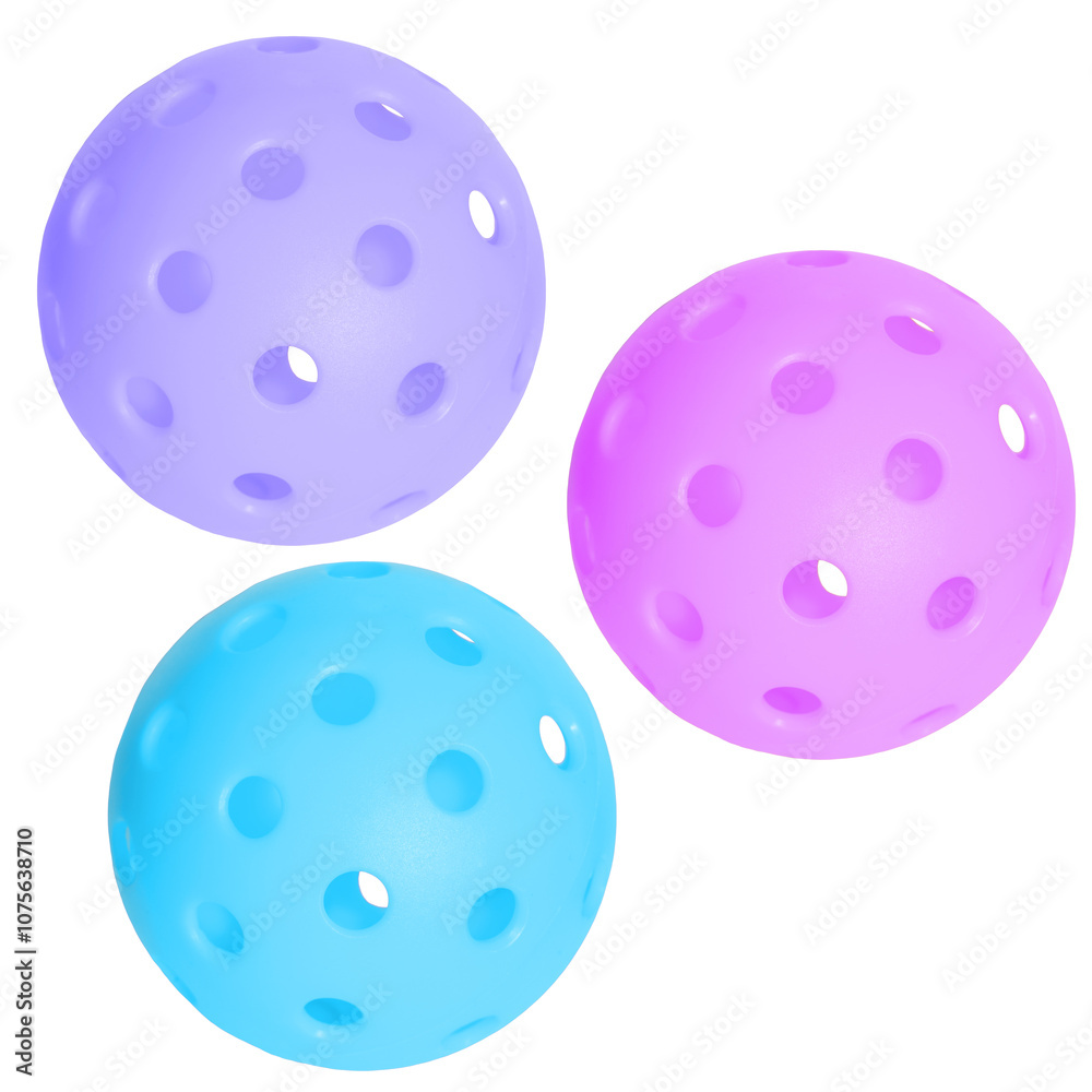 Three pickleball balls in light blue, pink and light purple isolated on transparent background.
