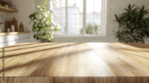 A wooden counter top with a white kitchen background. There are several kitchen items on the counter, including a knife, a spoon, and a bowl