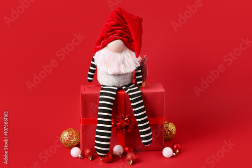 Christmas gnome with gift b...