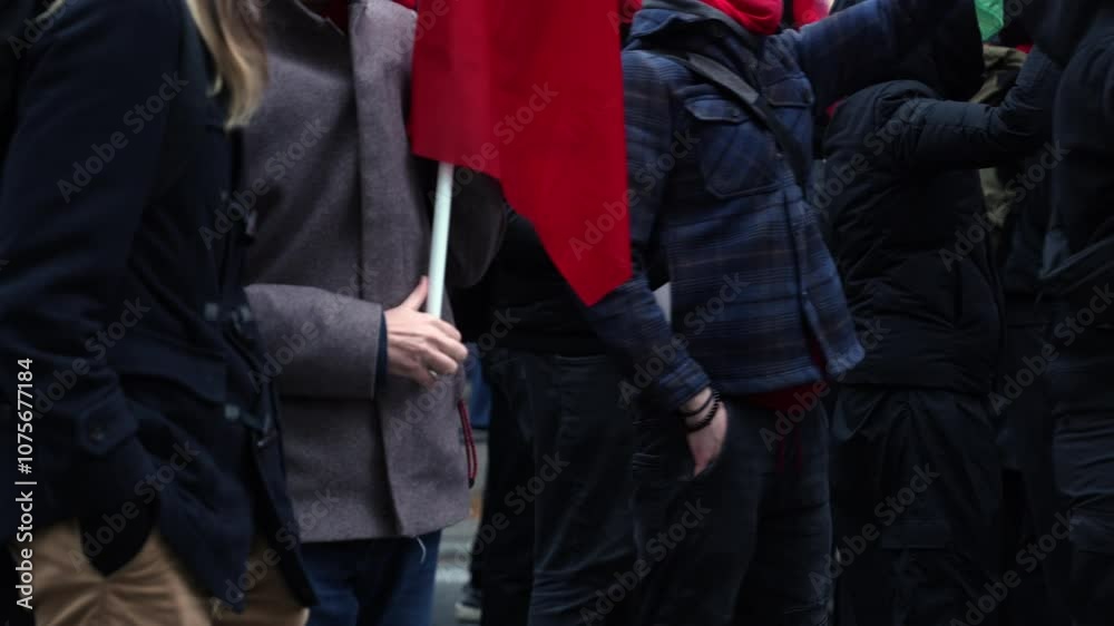A large march in a European city, escorted by police officers. A large march in a European city, escorted by police officers.