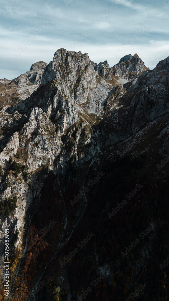 Rocky mountains in national park Prokletije in Montenegro in autumn season, aerial view. Breathtaking view of the mountain landscape. The Albanian Alps. Rocky mountains in national park Prokletije in Montenegro in autumn season, aerial view. Breathtaking view of the mountain landscape. The Albanian Alps.