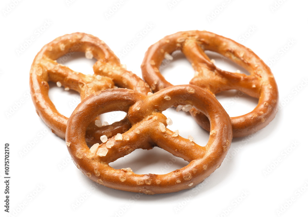 Many delicious pretzel crackers isolated on white Many delicious pretzel crackers isolated on white