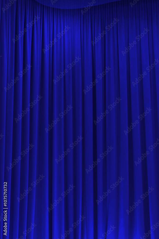 blue theater curtain that dropped down as a straight line. Background for inserting text, empty spaces blue theater curtain that dropped down as a straight line. Background for inserting text, empty spaces