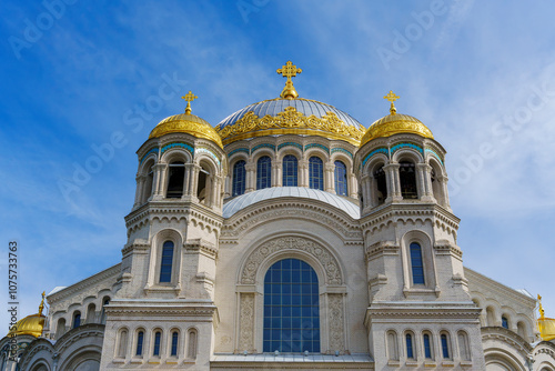 Majestic cathedral with golden domes under a blue sky