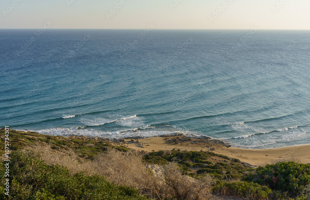 Capturing the serene beauty of gentle waves lapping against a secluded sandy beach at sunset. Capturing the serene beauty of gentle waves lapping against a secluded sandy beach at sunset.
