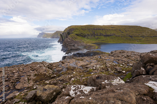 Bosdalafossur waterfall and Leitisvatn floating lake in the Faroe Islands photo