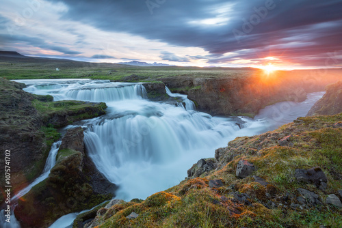 Beautiful waterfall in Iceland at sunset