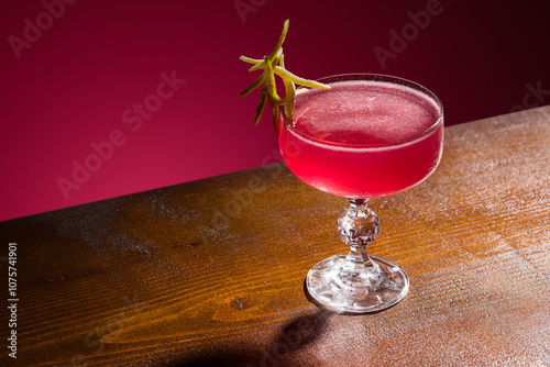 Crystal stemmed glass with vibrant cosmopolitan cocktail photo