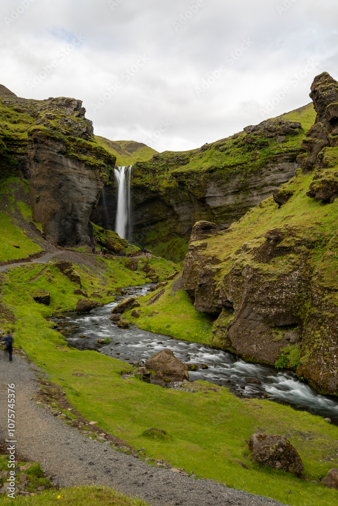 Path and river leading to waterfall in Iceland Path and river leading to waterfall in Iceland
